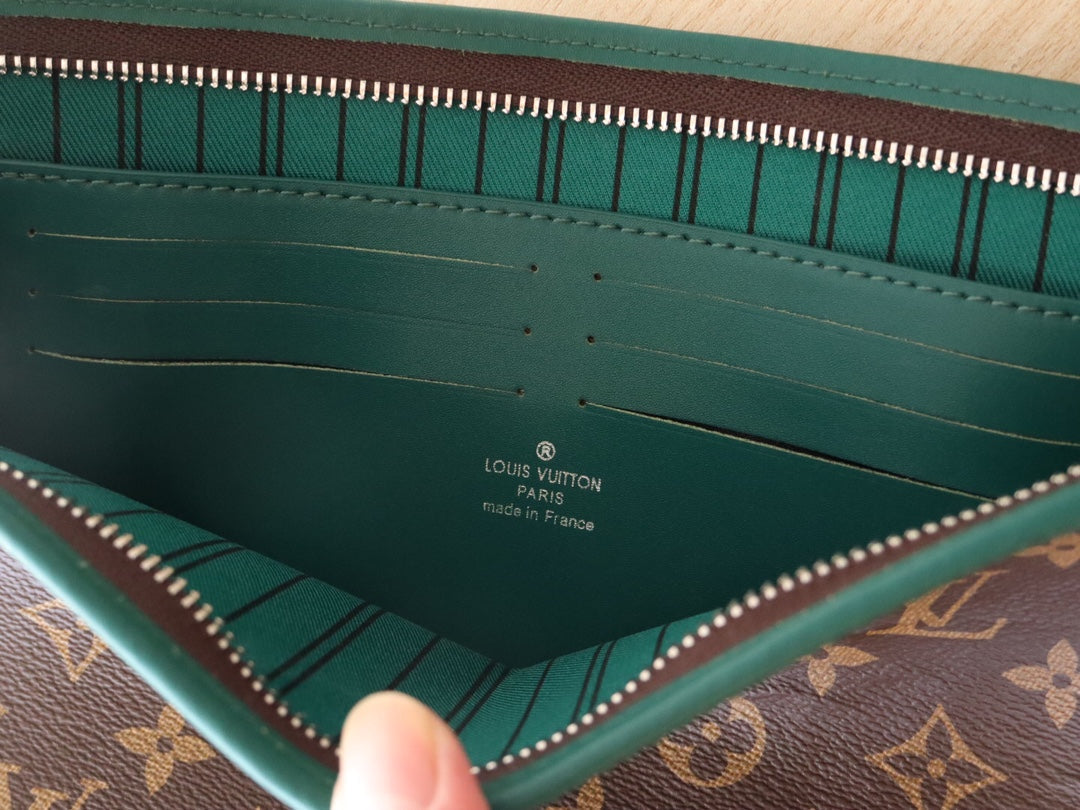 LV 25S POCHETTE VOYAGE 26 IN BORNEO GREEN MONOGRAM MACASSAR COATED CANVAS