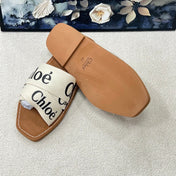 CHLOE 26S CRISSCROSS SLIDES IN BEIGE CANVAS