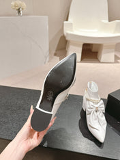 SHORT BOOTS IN WHITE SHEEPSKIN WITH BOW