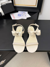 FLAT SANDALS IN WHITE CALFSKIN WITH BOW