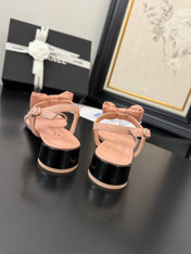 FLAT SANDALS IN PEACHY PINK CALFSKIN WITH BOW