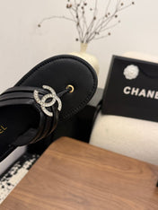 CHANEL 26S THONG SANDALS IN BLACK CALFSKIN WITH RHINESTONE CC LOGO