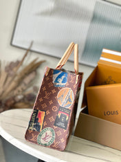 ONTHEGO VOYAGE 35 IN BROWN MONOGRAM CANVAS WITH VINTAGE HOTEL LABELS