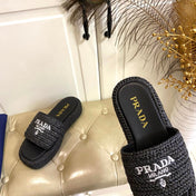 PRADA 26S SLIDE SANDALS IN BLACK LOGO RAFFIA