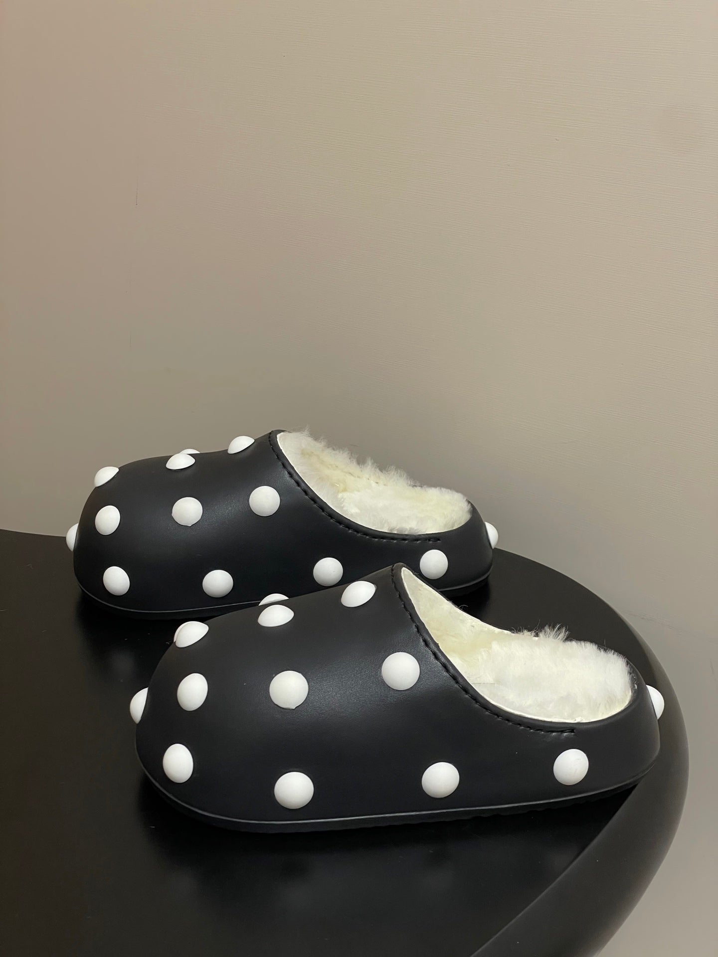 BALENCIAGA 25S FUR-LINED MULES IN BLACK AND WHITE FAUX LEATHER