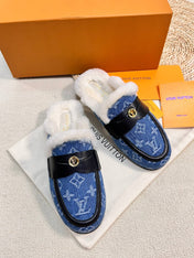 FLAT MULE IN COBALT BLUE MONOGRAM DENIM AND SHEARLING LINING