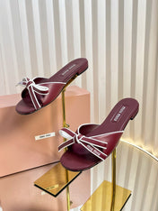 SLIDES SANDALS IN BURGUNDY RED CALFSKIN BOW IN TRAP