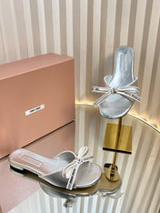 SLIDES SANDALS IN SILVER PATENT CALFSKIN BOW IN TRAP