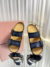 MIUMIU 26S DOUBLE-STRAP SLIDES IN BLACK CALFSKIN