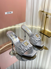 MIUMIU 26S HIGH-HEEL MULE SANDALS 85MM IN SILVER CALFSKIN GOLD HARDWARE