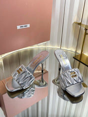 MIUMIU 26S HIGH-HEEL MULE SANDALS 85MM IN SILVER CALFSKIN GOLD HARDWARE
