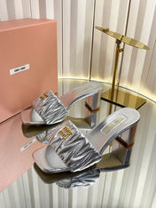 MIUMIU 26S PADDED MATELASSE MULE HEELS 65MM IN SILVER CALFSKIN GOLD HARDWARE