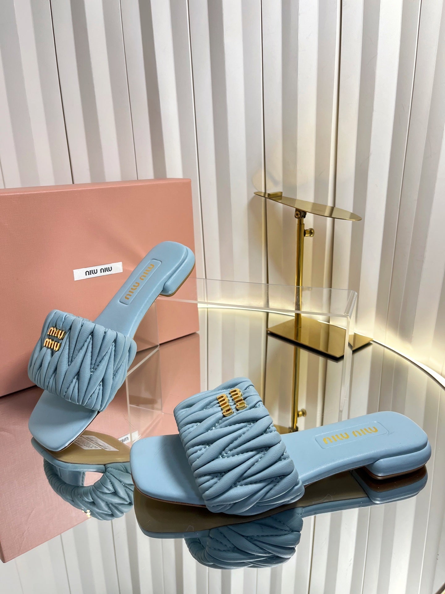 MIUMIU 26S MATELASSE SLIDES IN LIGHT BLUE CALFSKIN GOLD HARDWARE