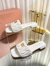 MIUMIU 26S MATELASSE SLIDES IN IVORY WHITE CALFSKIN GOLD HARDWARE