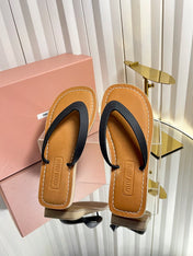 MIUMIU 26S THONG FLAT SANDALS IN BLACK CALFSKIN