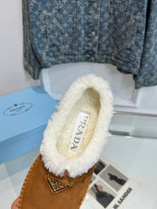 TRIANGLE LOGO MULES IN BRONZE BROWN SUEDE AND SHEARLING LINING