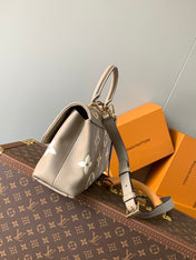 MADELEINE 30 IN BEIGE MONOGRAM CALFSKIN EMBOSSED LOGO