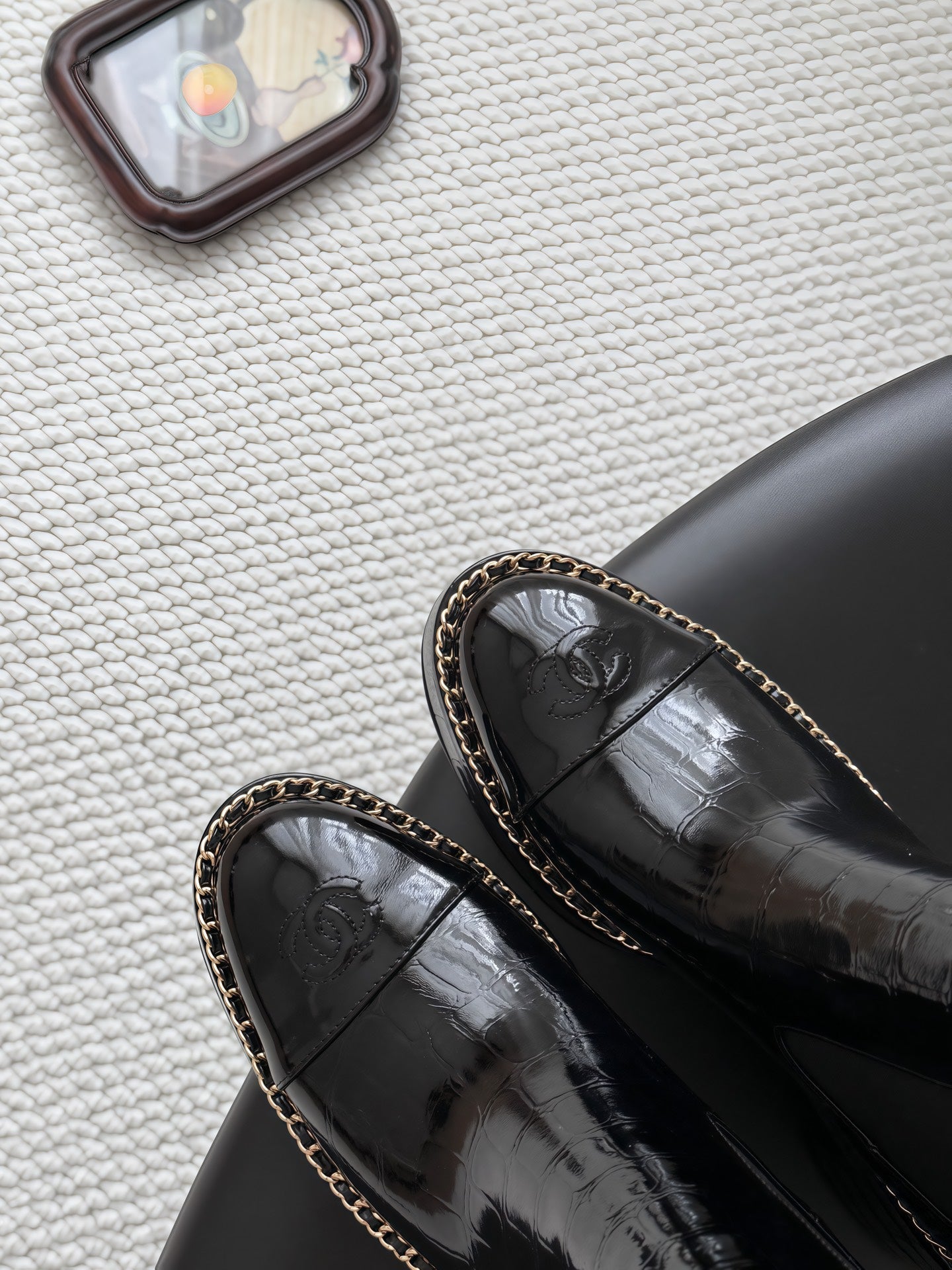 CHANEL 26S CHELSEA ANKLE BOOTS 70 MM IN BLACK EMBOSSED AND PATENT