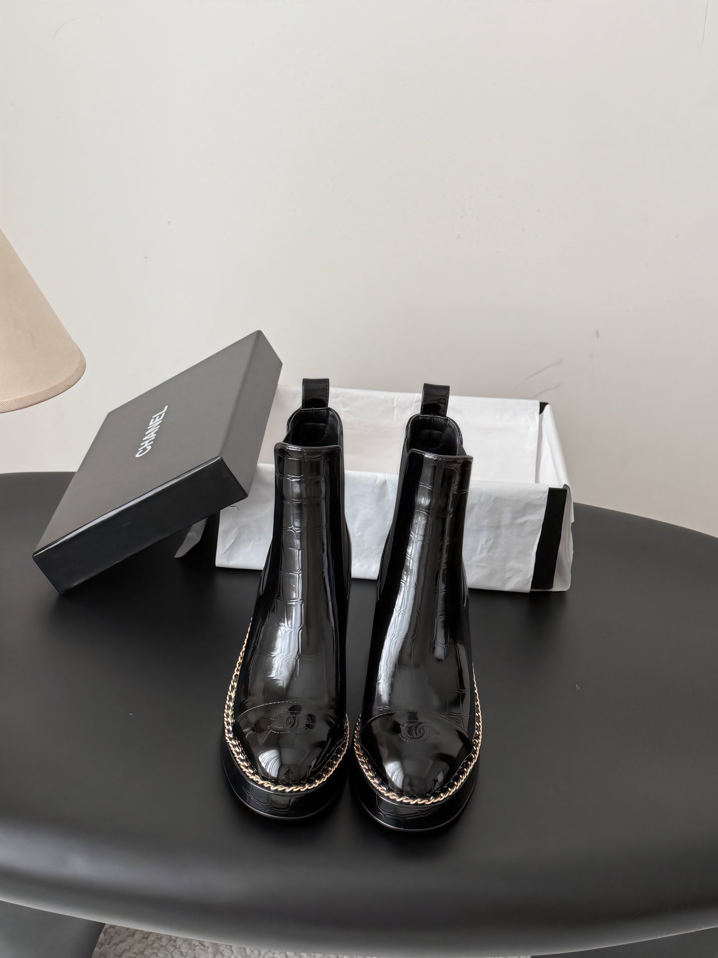 CHANEL 26S CHELSEA ANKLE BOOTS 70 MM IN BLACK EMBOSSED AND PATENT