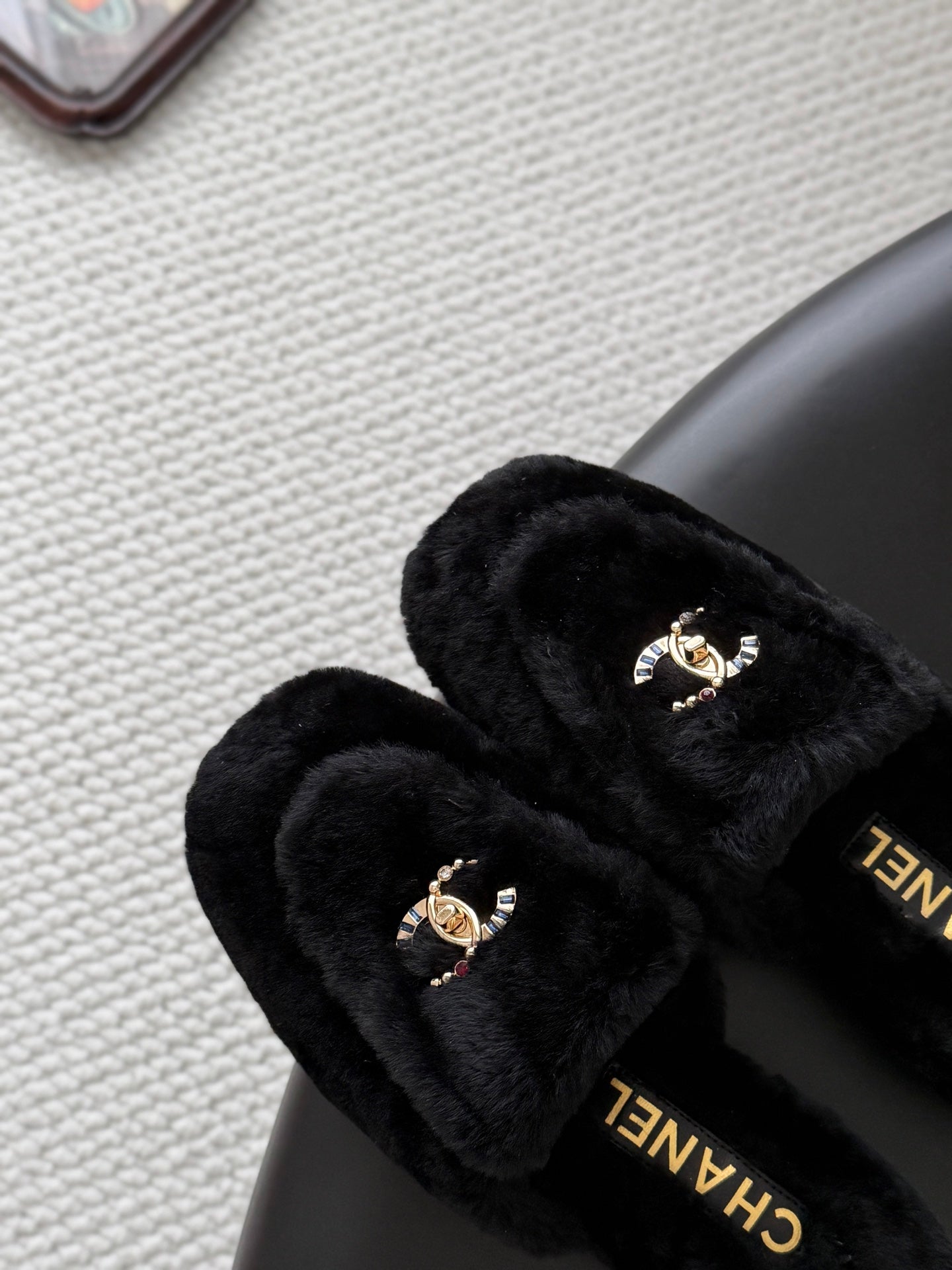 CHANEL 26S MULES IN BLACK SHEARLING LINING