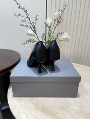 CURVED HEEL SHALLOW MOUTH PUMPS IN BLACK CALFSKIN