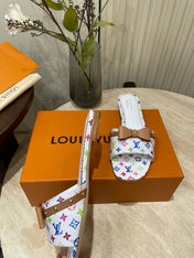 FLAT MULES IN WHITE MONOGRAM LAMBSKIN