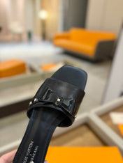 LV X TM 6AM FLAT MULE IN BLACK CALFSKIN