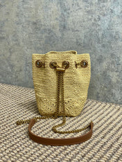 DRAWSTRING BUCKET BAG 19 IN BEIGE WOVEN RAFFIA AND CALFSKIN