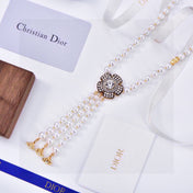 CD 26S PEARL FLORAL TASSEL NECKLACE IN GOLD TONE METAL 629122