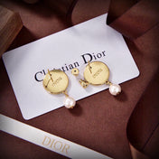 CD 26S STAR LOGO PEARL DROP EARRINGS IN GOLD TONE METAL 629949