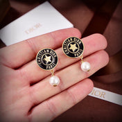 CD 26S STAR LOGO PEARL DROP EARRINGS IN GOLD TONE METAL 629949
