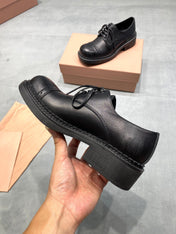 MIUMIU 26S LACE-UP LOAFERS IN BLACK GRAINED CALFSKIN
