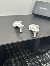 CHANEL 26S HIGH-HEEL THONG SANDALS IN WHITE LAMBSKIN WITH FLOWER DETAIL