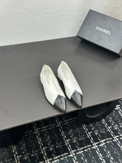 CHANEL 26S FLAT SHOES IN WHITE AND BLACK LAMBSKIN