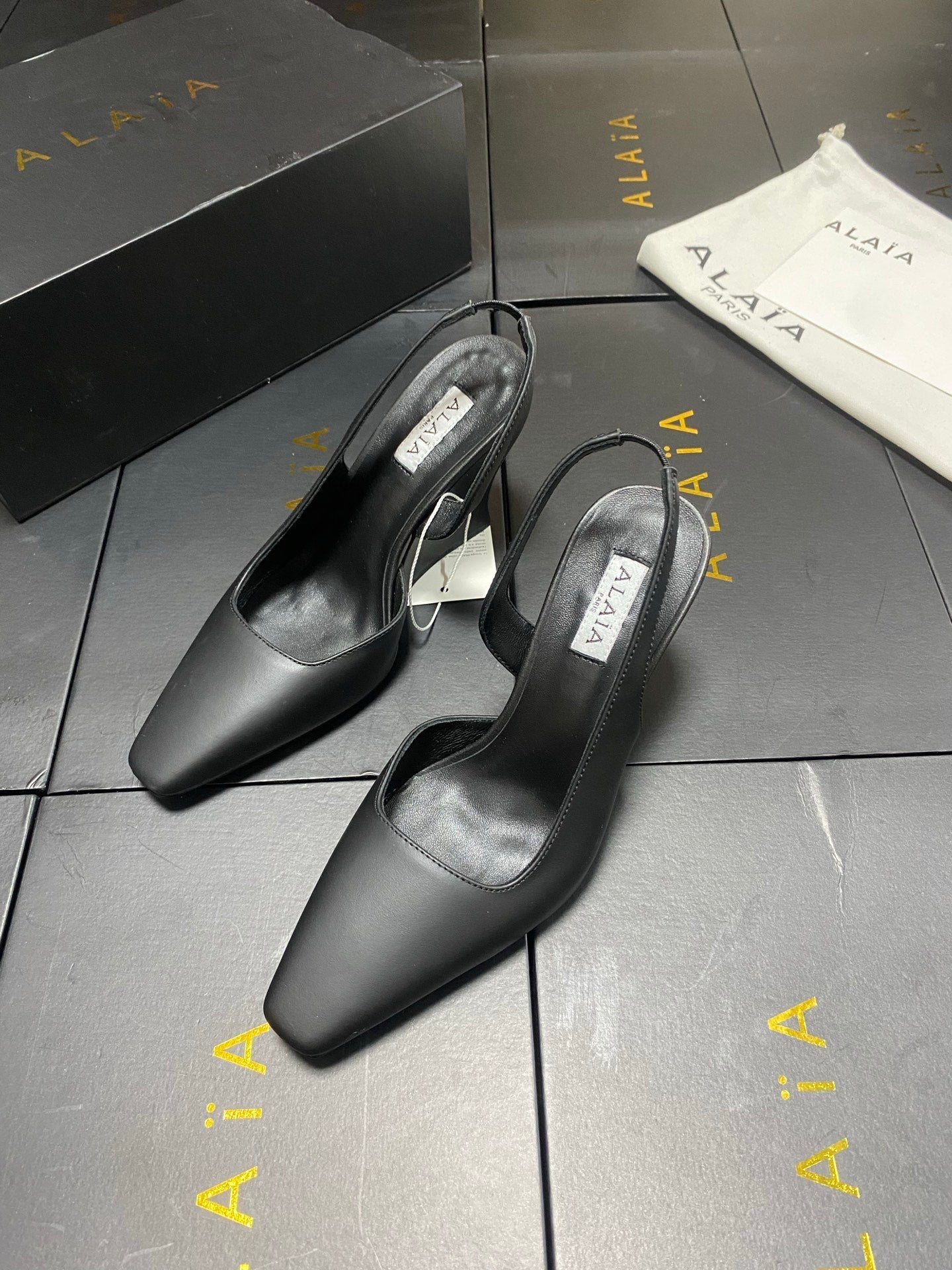 ALAIA 26S WEDGE SLINGBACKS 95 MM IN BLACK CALFSKIN