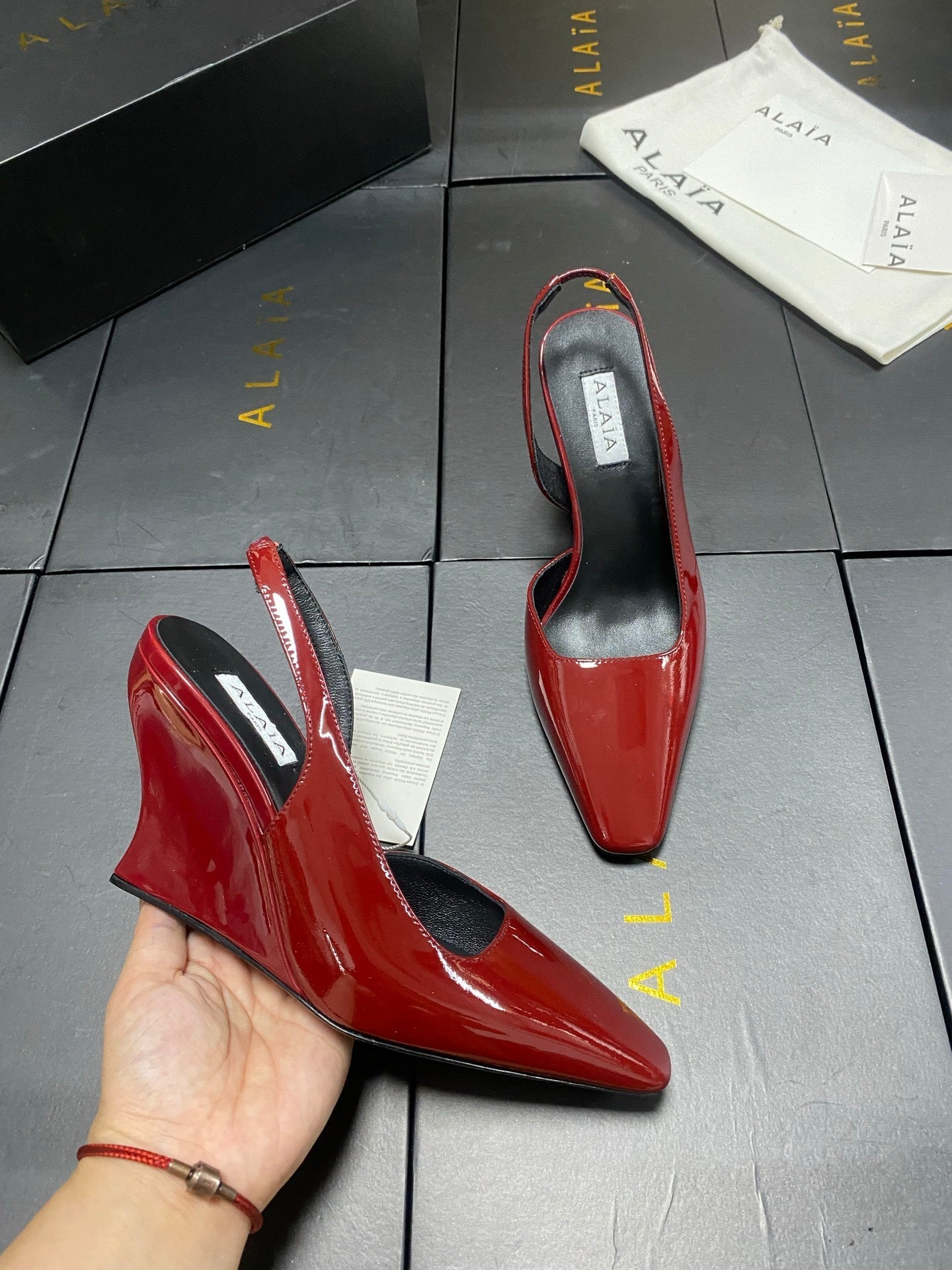 ALAIA 26S WEDGE SLINGBACKS 95 MM IN DARK RED PATENT CALFSKIN