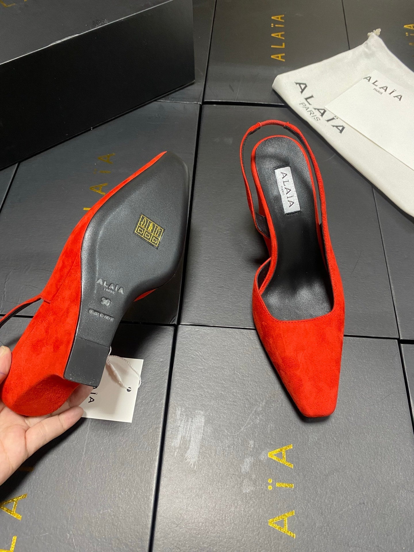 ALAIA 26S WEDGE SLINGBACKS 95 MM IN ORANGE RED SUEDE
