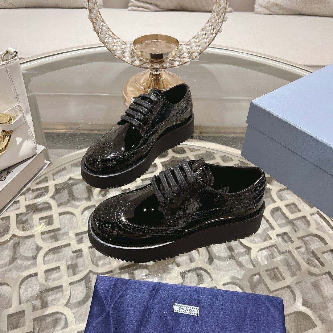 PRADA 26S BROGUE SHOES IN BLACK PATENT CALFSKIN