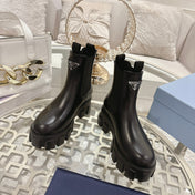 PRADA 26S MONOLITH CHELSEA BOOTS IN BLACK CALFSKIN AND FABRIC