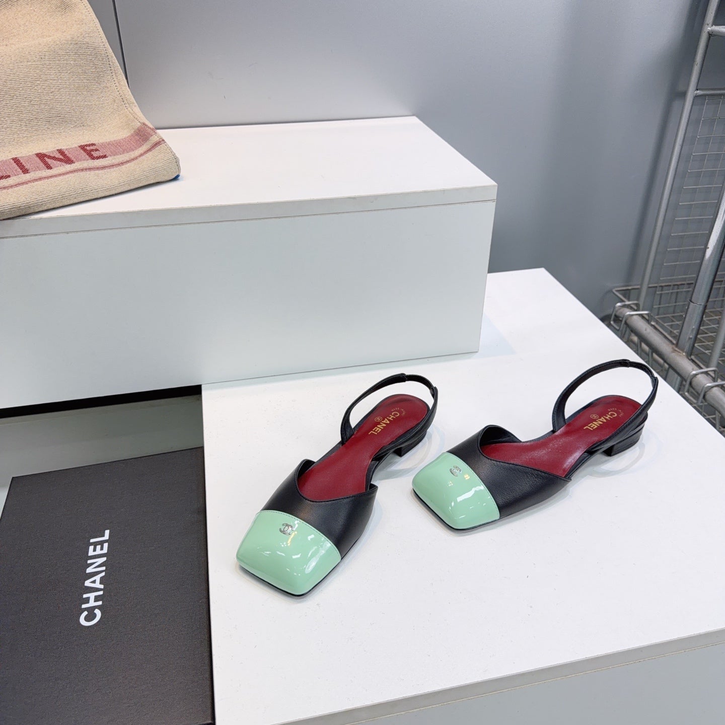 CHANEL 26S FLAT SLINGBACK IN BLACK LAMBSKIN WITH MINT GREEN CAP TOE