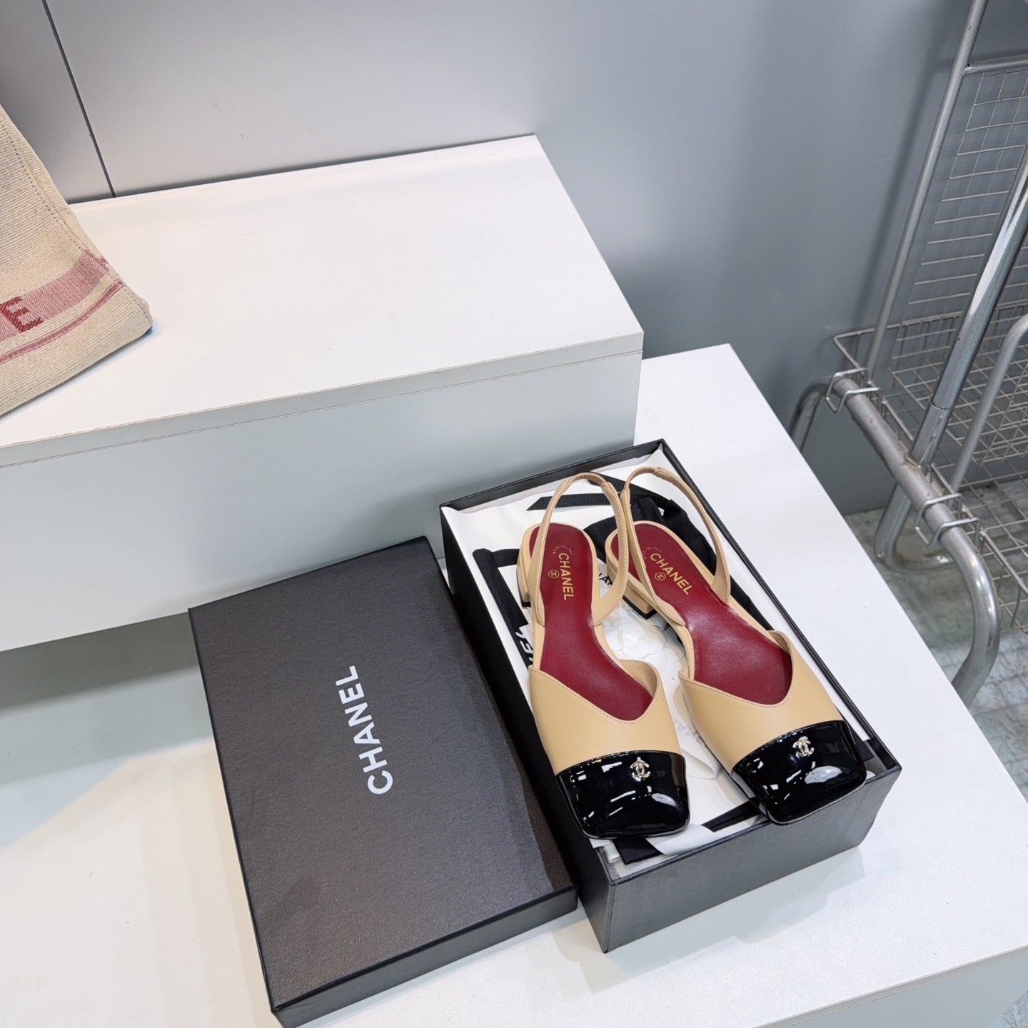CHANEL 26S FLAT SLINGBACK IN BEIGE LAMBSKIN WITH BLACK CAP TOE