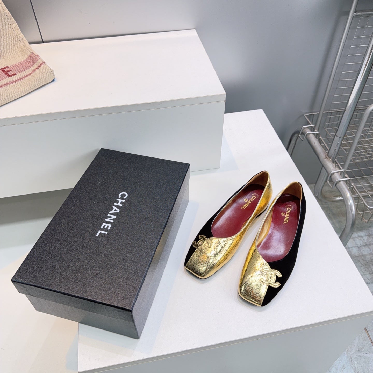 CHANEL 26S SQUARE-TOE FLATS IN GOLD LAMBSKIN AND BLACK SUEDE