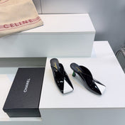 CHANEL 26S HIGH-HEEL MULES 70 MM IN BLACK AND WHITE LAMBSKIN