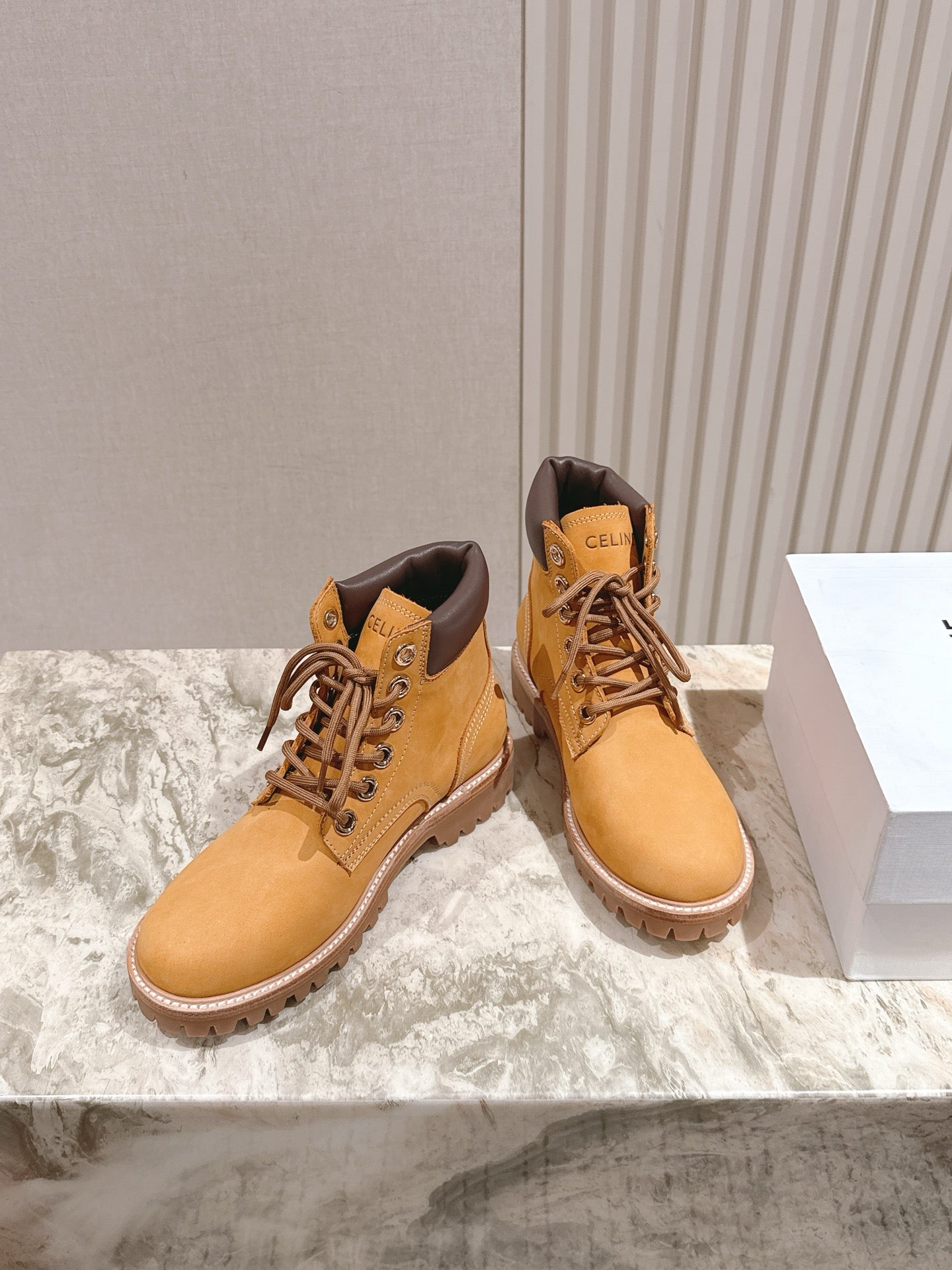 CELINE 25S MARTIN BOOTS IN MEDIUM ORANGE CALFSKIN