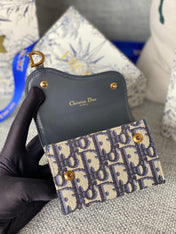 SADDLE LOTUS WALLET 11 IN BLACK MONOGRAM OBLIQUE JACQUARD