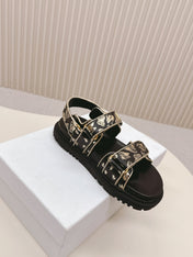 DIOR BACK-STRAP SANDALS 25S IN BLACK AND GOLD CALFSKIN WITH BUTTERFLY MOTIF