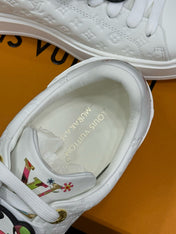 TIME OUT SNEAKER IN WHITE EMBOSSED MONOGRAM CALFSKIN