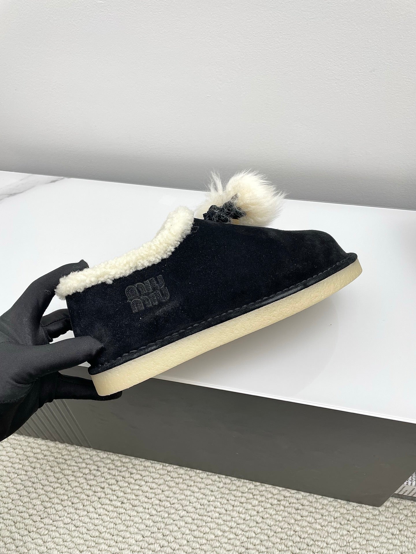MIUMIU 26S ANKLE SHEARLING BOOTS IN BLACK SUEDE