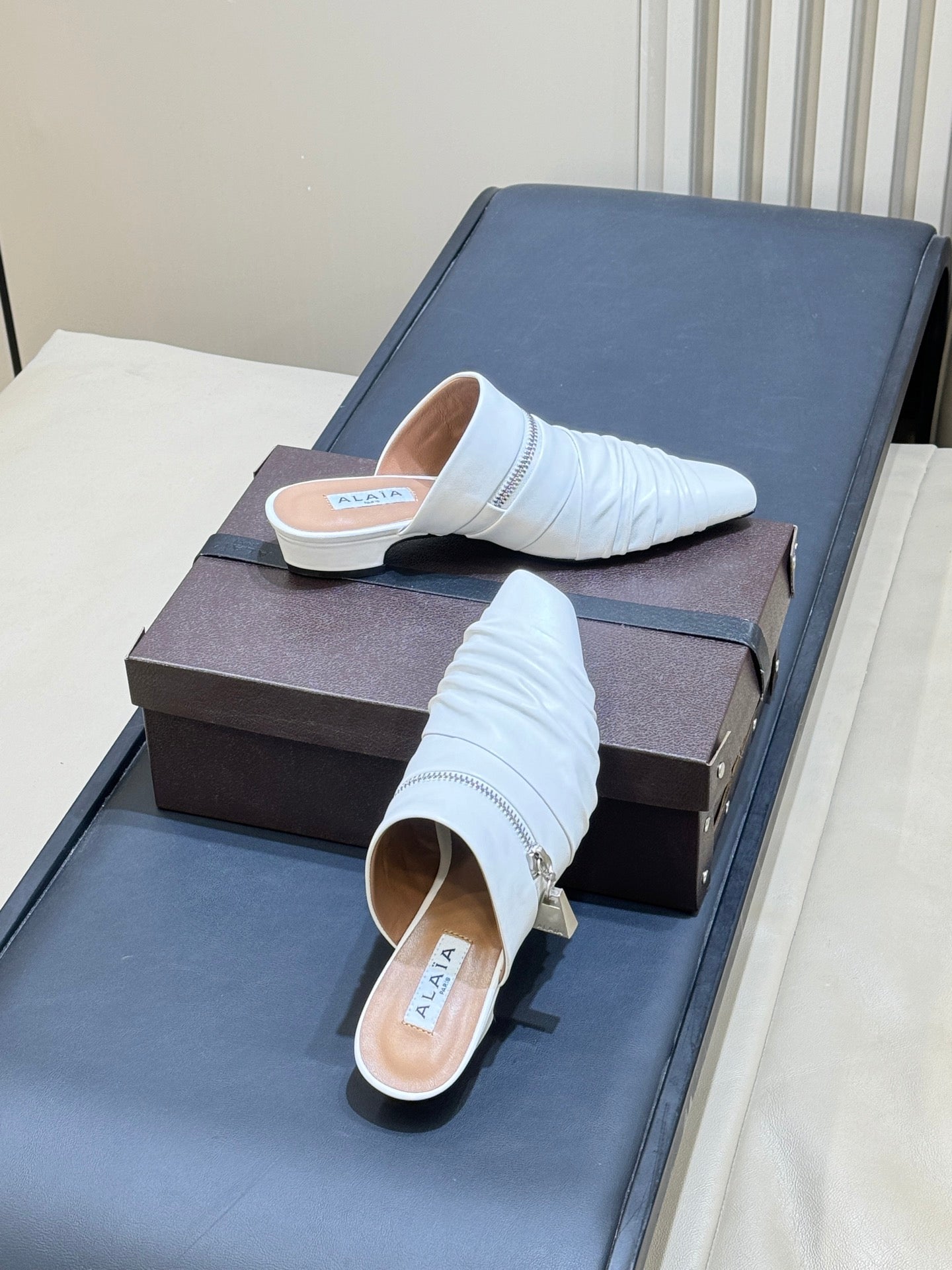ALAIA 26S PLEATED MULES IN WHITE LAMBSKIN