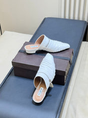 ALAIA 26S PLEATED MULES IN WHITE LAMBSKIN